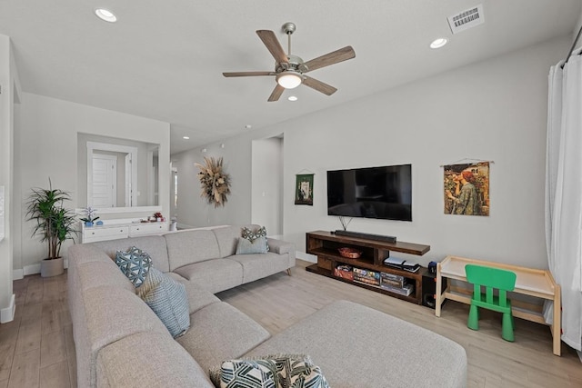 living room with recessed lighting, wood finished floors, a ceiling fan, baseboards, and visible vents