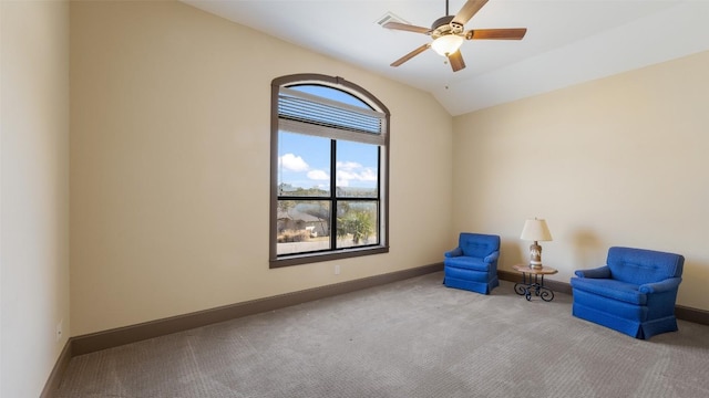 unfurnished room with lofted ceiling, carpet floors, ceiling fan, and baseboards