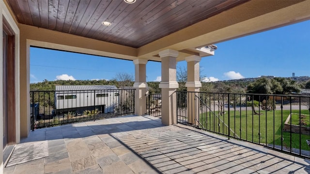 view of patio featuring a balcony