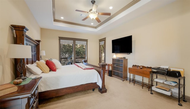 bedroom featuring light carpet, a tray ceiling, crown molding, and recessed lighting