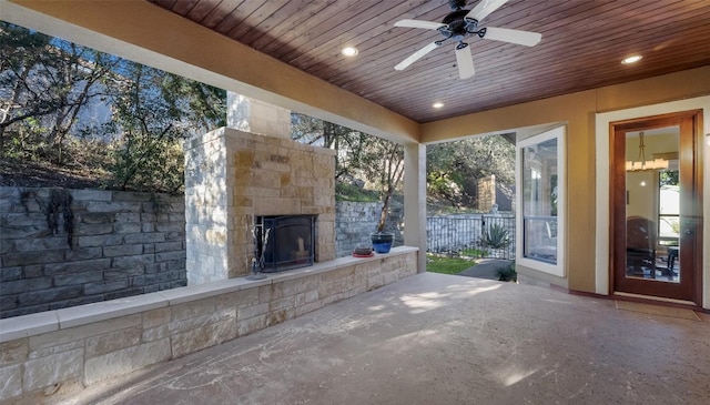 15100 Canary St, Austin, TX 78734 - view of patio / terrace featuring an outdoor stone fireplace and ceiling fan