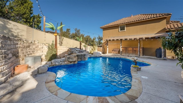 view of pool featuring a patio area, a fenced backyard, and a fenced in pool