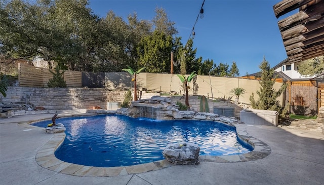 view of pool with a fenced backyard, a fenced in pool, and a patio