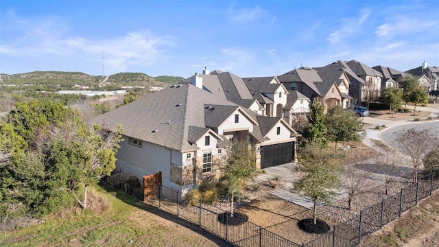 birds eye view of property with a residential view