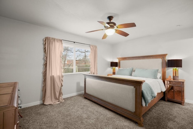 carpeted bedroom with ceiling fan and baseboards