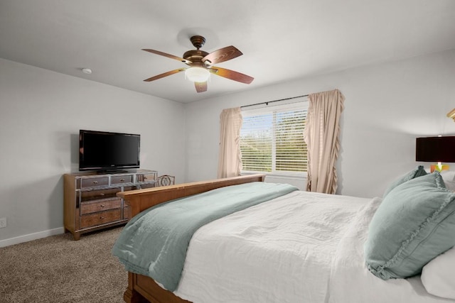 bedroom with baseboards, a ceiling fan, and carpet floors