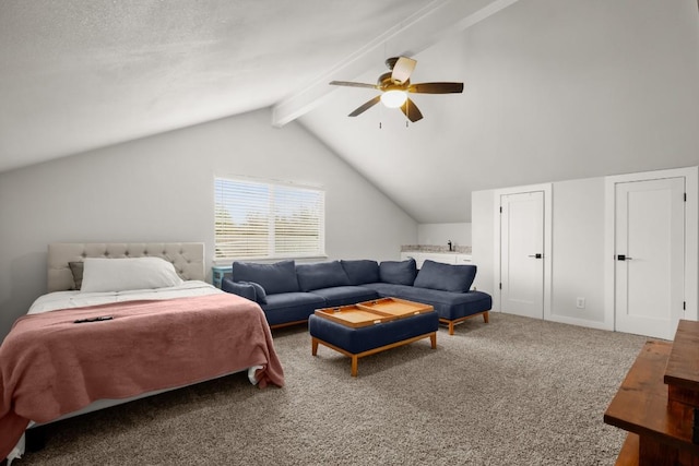 carpeted bedroom with ceiling fan and lofted ceiling with beams