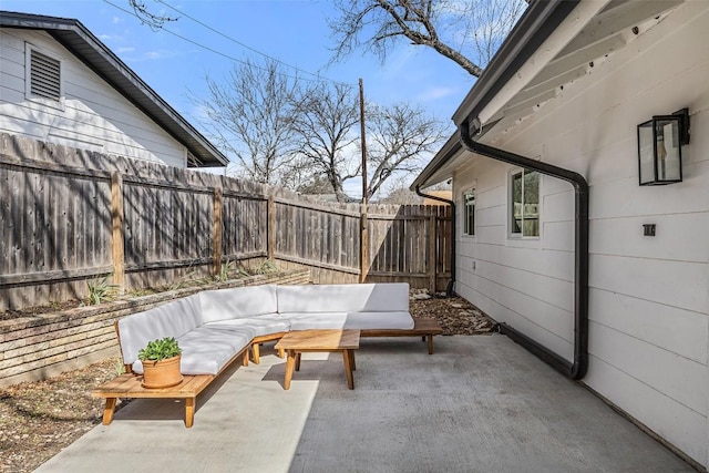 view of patio / terrace with fence and an outdoor hangout area