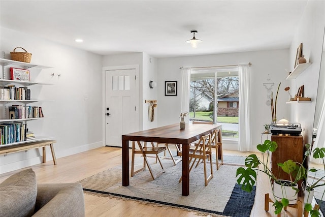 dining area featuring light wood-type flooring, baseboards, and recessed lighting