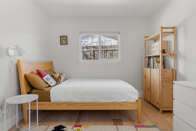 bedroom featuring light wood-style floors