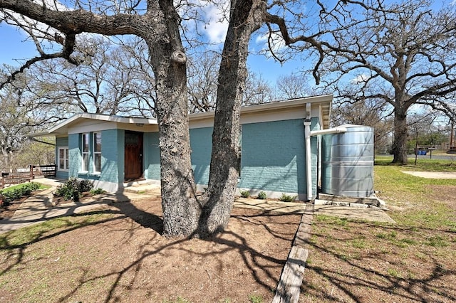 exterior space with brick siding