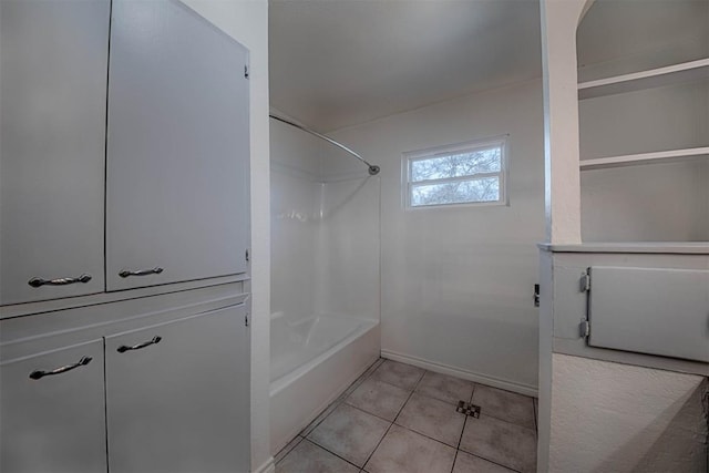 bathroom with bathtub / shower combination and tile patterned floors