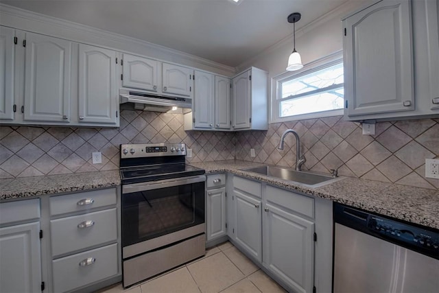 kitchen with decorative backsplash, stainless steel appliances, under cabinet range hood, a sink, and light tile patterned flooring