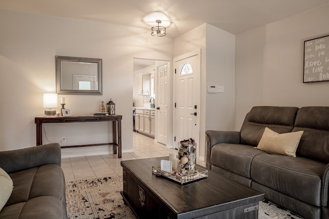 living room featuring light tile patterned flooring and baseboards