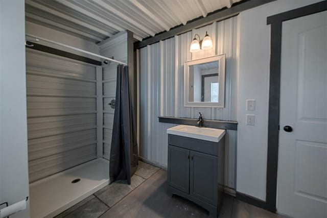 bathroom with a stall shower and vanity