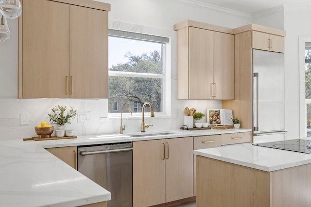 kitchen with light brown cabinets, light stone counters, stainless steel dishwasher, and built in fridge