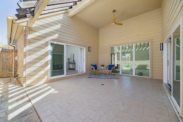 view of patio / terrace with a ceiling fan and a pergola