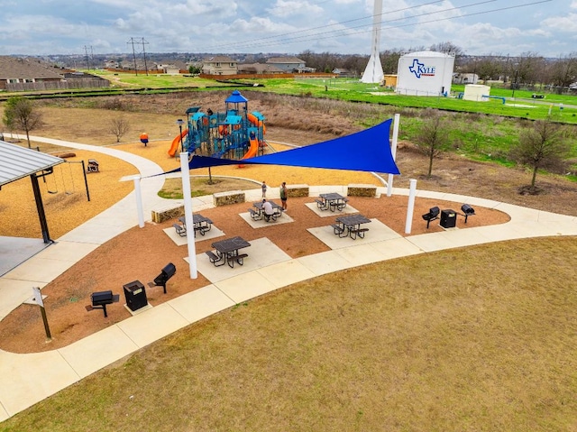 community play area featuring a lawn