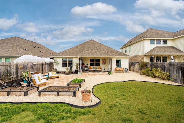 back of property featuring a patio, a lawn, a fenced backyard, a garden, and an outdoor living space