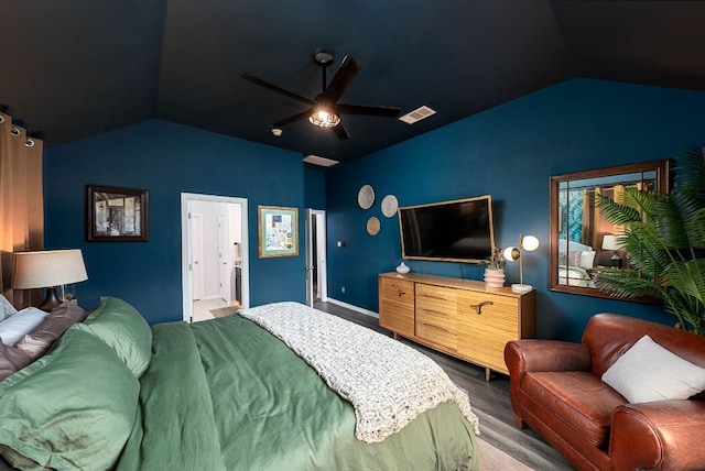 bedroom with ceiling fan, visible vents, vaulted ceiling, and wood finished floors