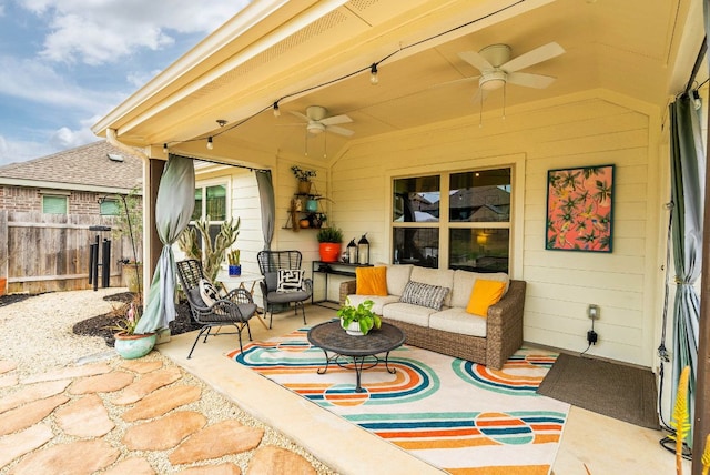 view of patio / terrace featuring ceiling fan, fence, and outdoor lounge area