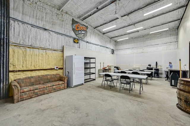 garage with freestanding refrigerator