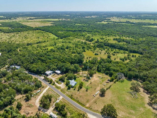 birds eye view of property with a wooded view