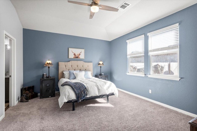 bedroom with visible vents, a ceiling fan, carpet flooring, vaulted ceiling, and baseboards