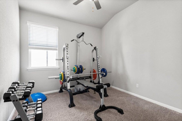 exercise room featuring lofted ceiling, carpet, a ceiling fan, and baseboards