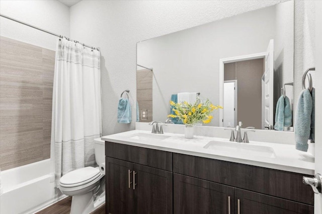 full bath with double vanity, a sink, toilet, and shower / bathtub combination with curtain