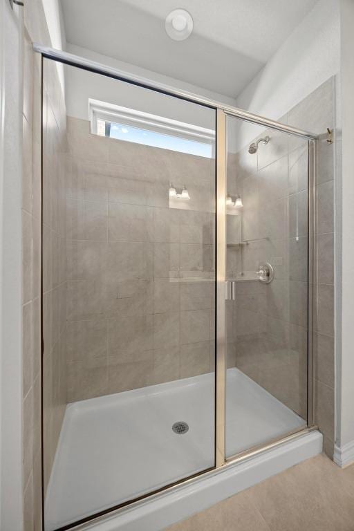 bathroom featuring a shower stall