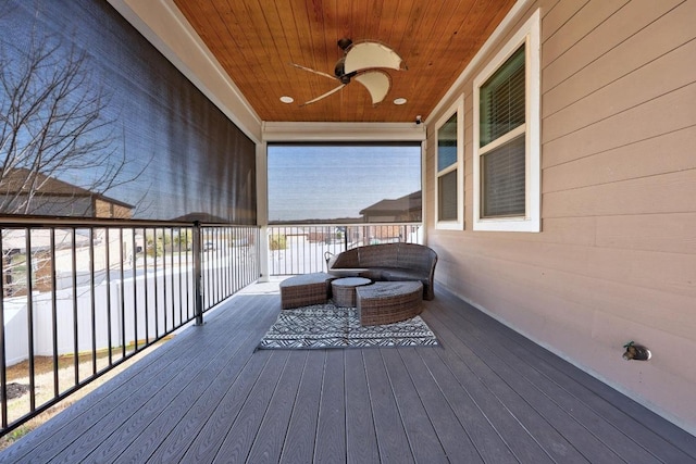 wooden terrace with a ceiling fan