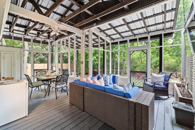 sunroom featuring a ceiling fan