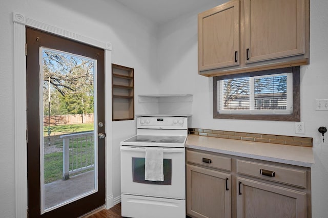 106 Park Dr, Bastrop, TX 78602 - kitchen featuring white electric stove, light countertops, open shelves, light brown cabinets, and tasteful backsplash