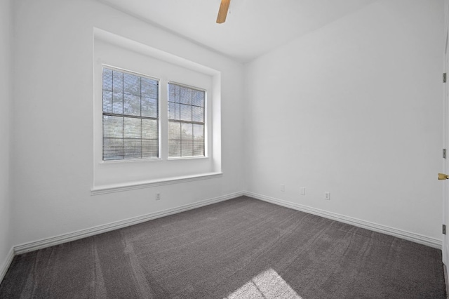106 Park Dr, Bastrop, TX 78602 - spare room featuring dark carpet and a ceiling fan
