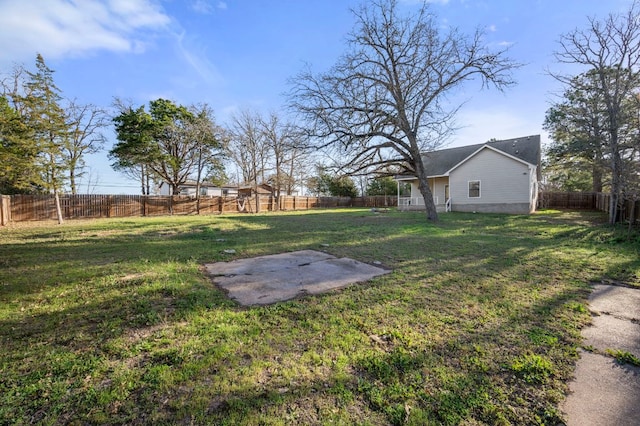 view of yard with a patio area and a fenced backyard