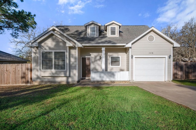 cape cod home with a garage, fence, concrete driveway, and a front yard