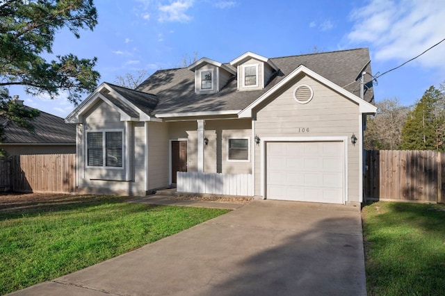 view of front facade featuring concrete driveway, a front lawn, an attached garage, and fence