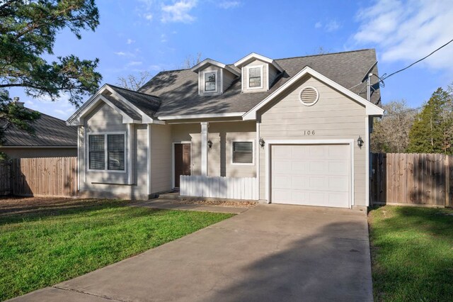 106 Park Dr, Bastrop, TX 78602 - view of front of home featuring a garage, concrete driveway, and roof with shingles