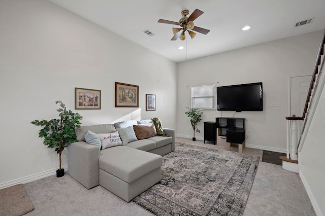 living room with stairs, carpet flooring, visible vents, and baseboards