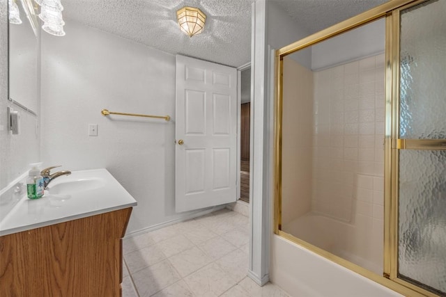 1876 Rocky Rd, Blanco, TX 78606 - bathroom with vanity, enclosed tub / shower combo, and a textured ceiling
