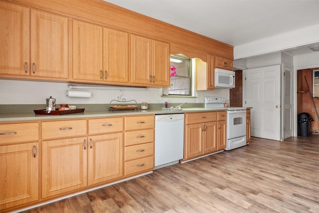 1876 Rocky Rd, Blanco, TX 78606 - kitchen with white appliances, light wood finished floors, and light countertops