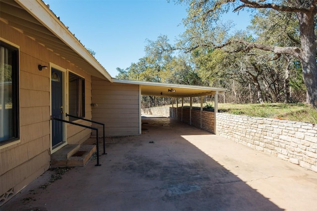 1876 Rocky Rd, Blanco, TX 78606 - view of patio with driveway and an attached carport