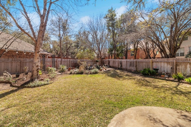 view of yard with a fenced backyard