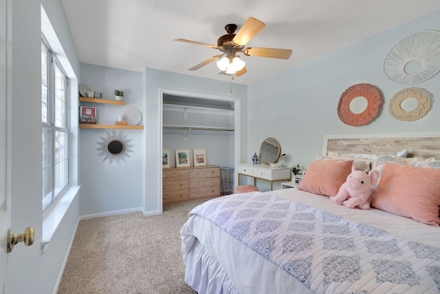 bedroom with ceiling fan, carpet floors, a closet, and baseboards