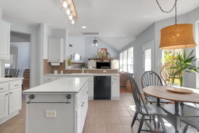 kitchen featuring light tile patterned floors, visible vents, decorative backsplash, a sink, and dishwasher