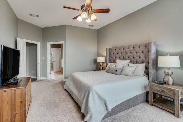 bedroom featuring a ceiling fan, light colored carpet, visible vents, and baseboards