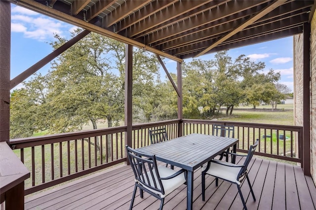 wooden terrace with outdoor dining area