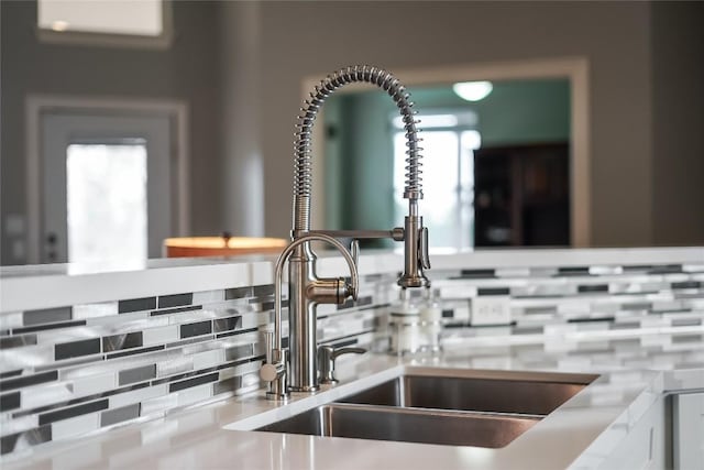 details with a sink and backsplash