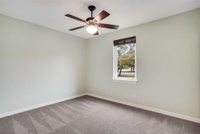 unfurnished room with carpet, baseboards, and ceiling fan